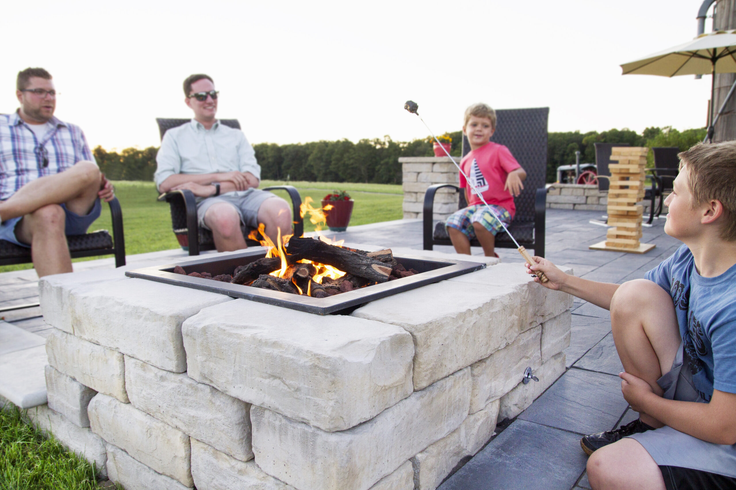 Gather around the Kodah Fire Pit Kit for years to come and make plenty of memories. Other products shown: Linear Flagstone